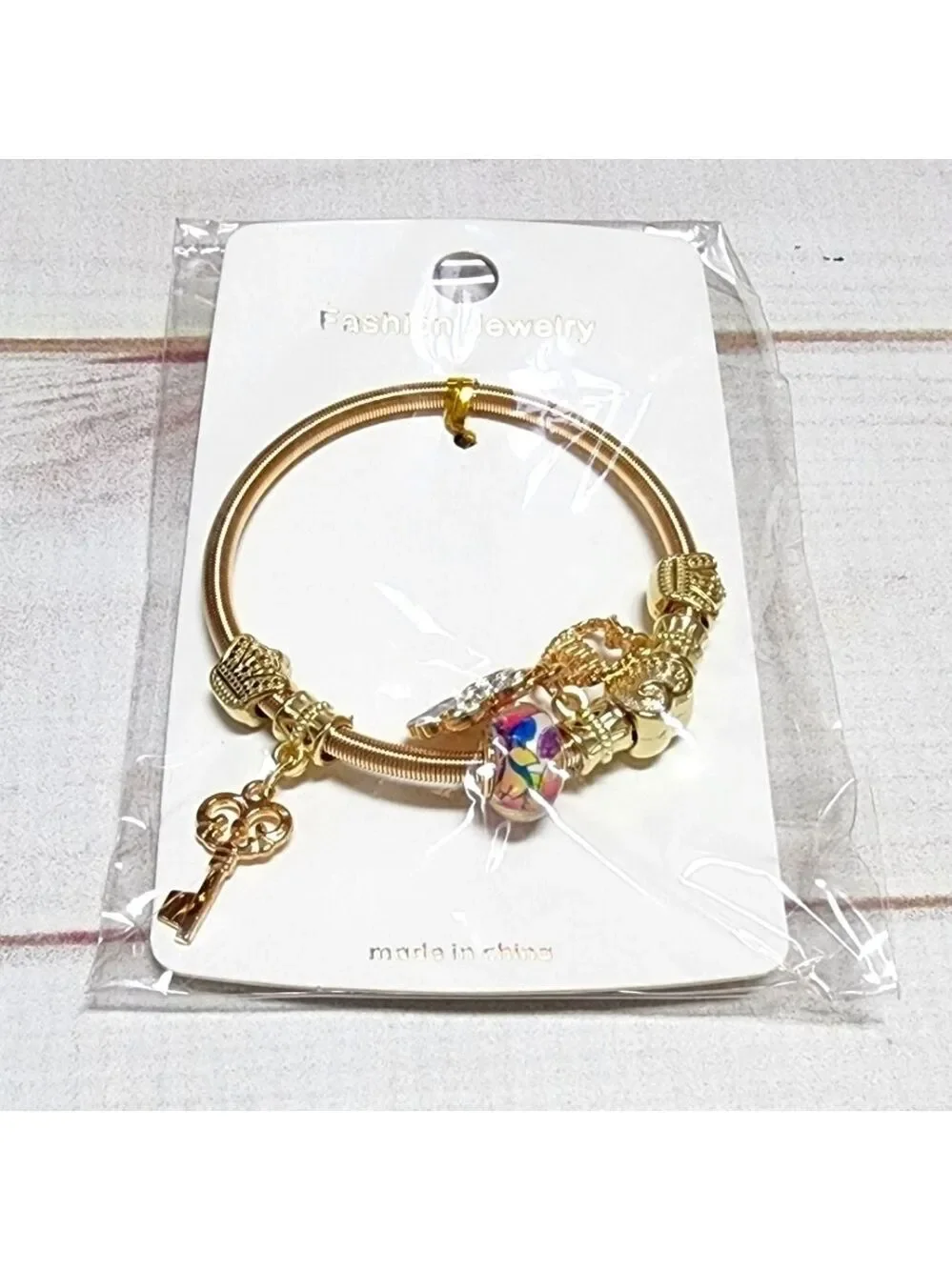 New Gold Sliding Charm Spring Bracelet